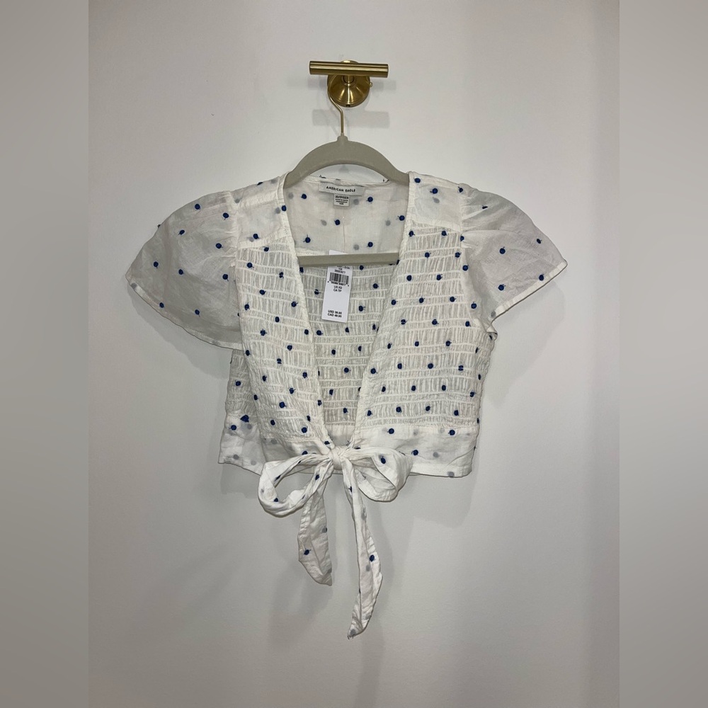White with blue polka dots tie blouse 
American Eagle